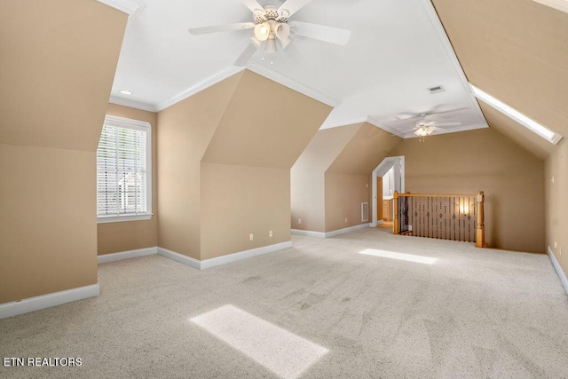 additional living space featuring carpet, ceiling fan, lofted ceiling, and baseboards