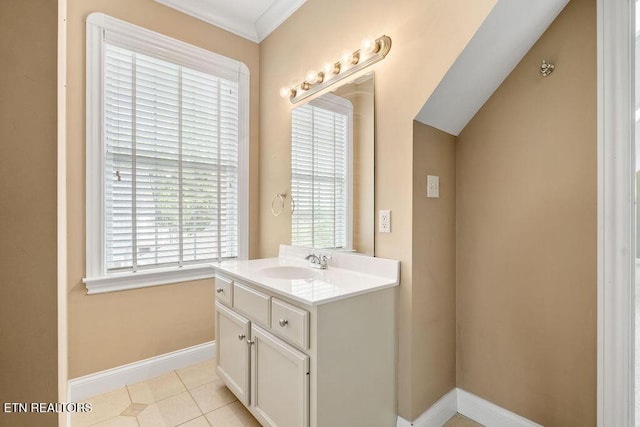 bathroom with vanity, tile patterned flooring, and baseboards