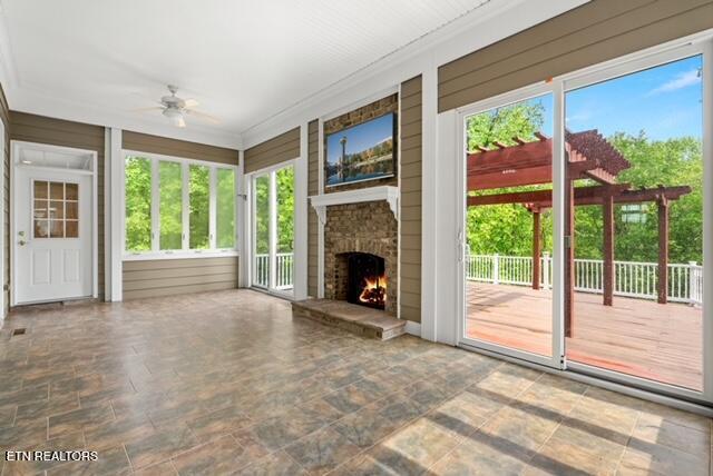 unfurnished sunroom featuring a healthy amount of sunlight