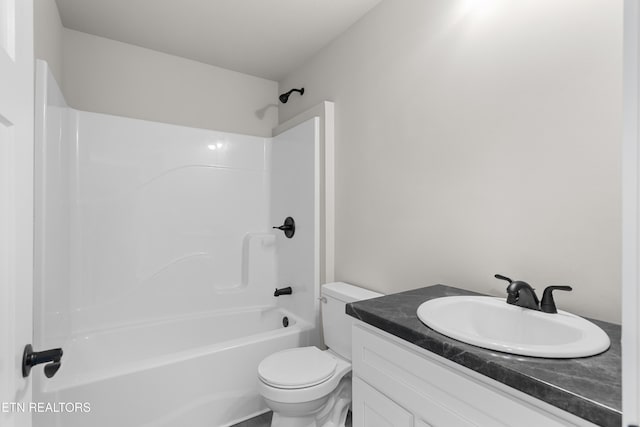 bathroom featuring shower / bathtub combination, toilet, and vanity