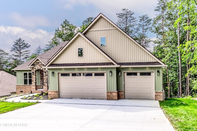 craftsman house with brick siding, driveway, a garage, and roof with shingles