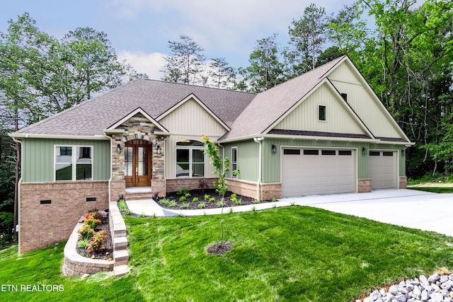 view of front of house with concrete driveway, brick siding, an attached garage, a shingled roof, and a front yard