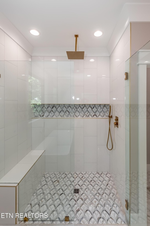 full bathroom with tiled shower