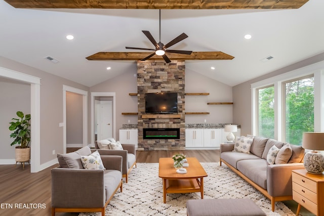 living room featuring lofted ceiling with beams, baseboards, visible vents, light wood-style floors, and ceiling fan