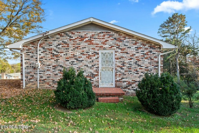 exterior space with brick siding