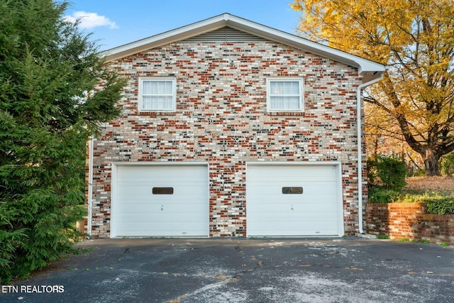 garage featuring driveway