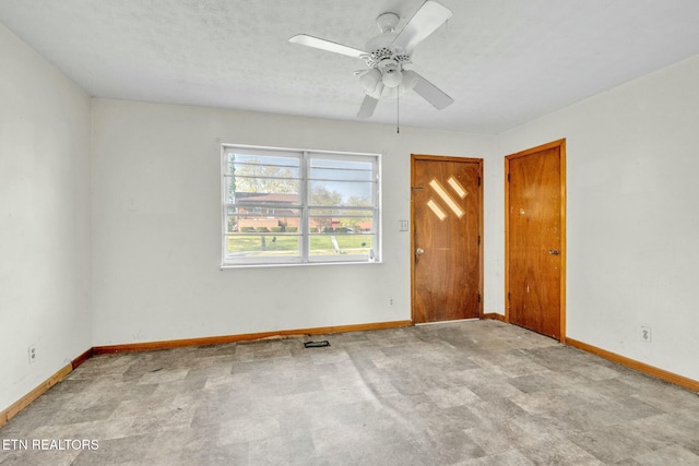 unfurnished bedroom with baseboards and a ceiling fan