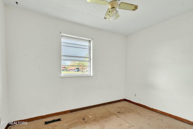 empty room featuring baseboards