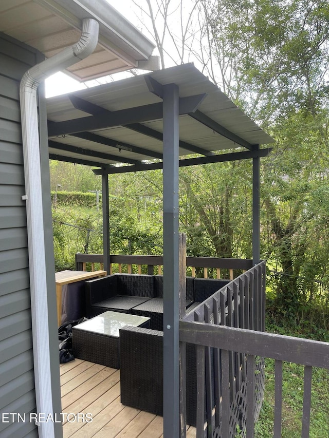 wooden deck featuring an outdoor living space