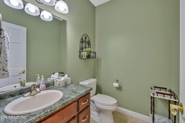 135 Austin Ln, Deer Lodge, TN 37726 - half bathroom with tile patterned flooring, toilet, vanity, and baseboards