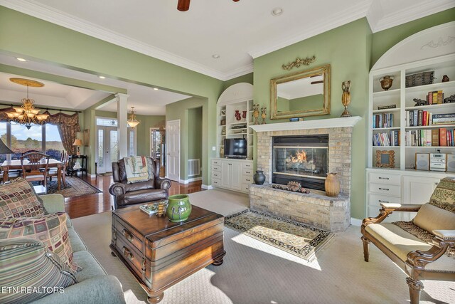 135 Austin Ln, Deer Lodge, TN 37726 - living area featuring a fireplace, visible vents, crown molding, and built in shelves
