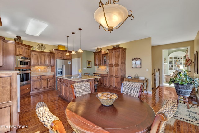 135 Austin Ln, Deer Lodge, TN 37726 - dining area featuring baseboards and dark wood finished floors