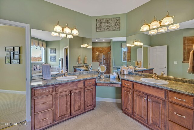 135 Austin Ln, Deer Lodge, TN 37726 - full bath featuring two vanities, a sink, and a shower stall