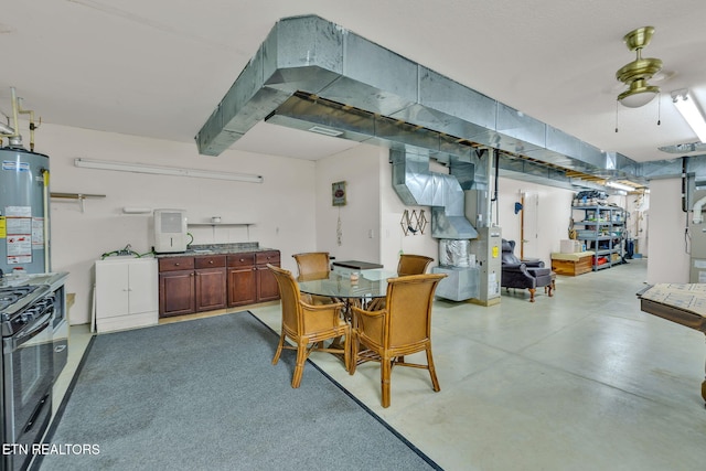 135 Austin Ln, Deer Lodge, TN 37726 - dining space featuring water heater, concrete floors, and a ceiling fan