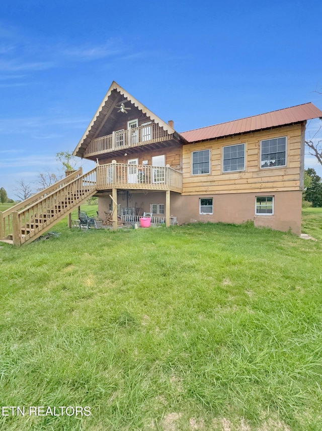 135 Austin Ln, Deer Lodge, TN 37726 - rear view of property with a lawn, a deck, stairs, and metal roof