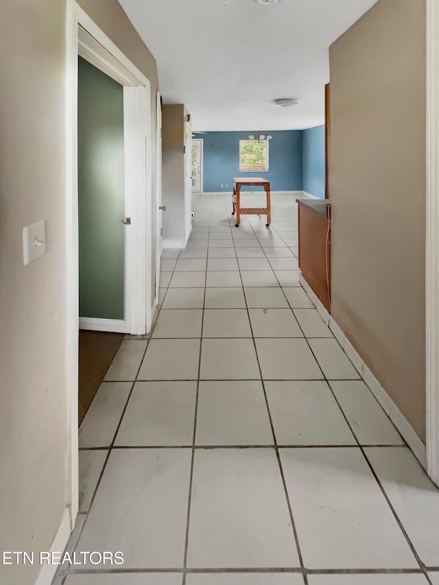 135 Austin Ln, Deer Lodge, TN 37726 - hallway featuring tile patterned flooring and baseboards