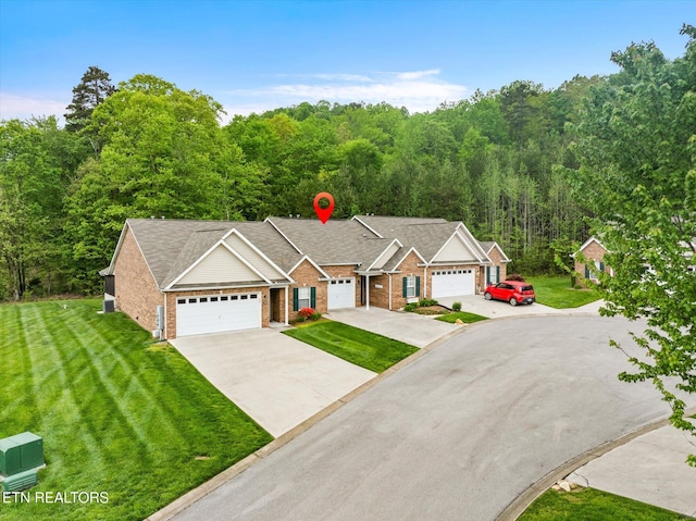 7143 La Christa Way, Knoxville, TN 37921 - ranch-style home with a shingled roof, an attached garage, driveway, brick siding, and a front yard