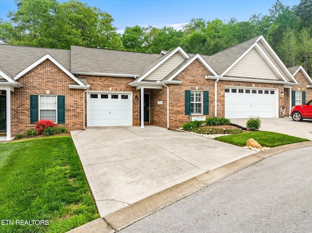 7143 La Christa Way, Knoxville, TN 37921 - view of front of house featuring brick siding, an attached garage, driveway, and a front yard
