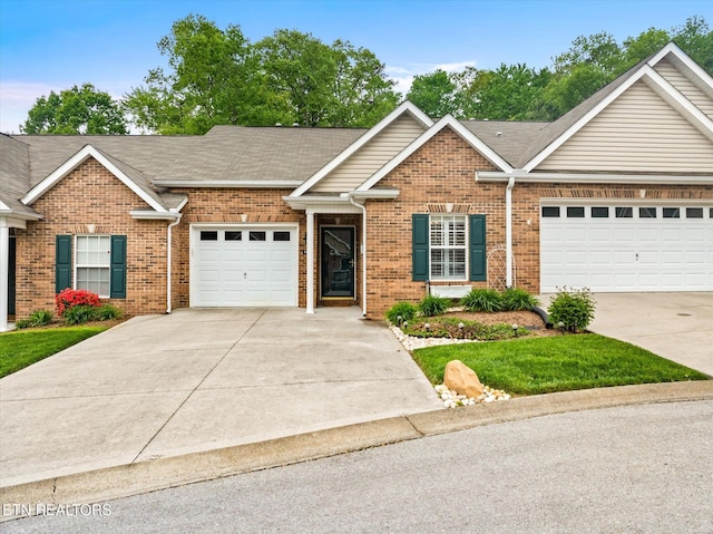 7143 La Christa Way, Knoxville, TN 37921 - view of front of property with an attached garage, driveway, brick siding, and roof with shingles