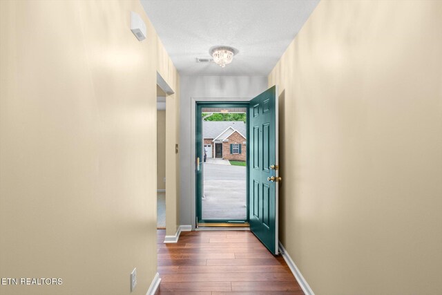 7143 La Christa Way, Knoxville, TN 37921 - entryway featuring dark wood-type flooring, a textured ceiling, baseboards, and visible vents