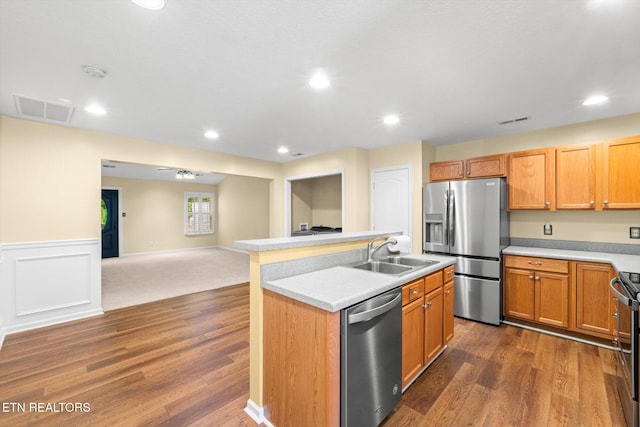 7143 La Christa Way, Knoxville, TN 37921 - kitchen with appliances with stainless steel finishes, a kitchen island with sink, a sink, and visible vents