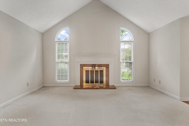 3804 Whitworth Dr, Knoxville, TN 37938 - unfurnished living room featuring lofted ceiling, a wealth of natural light, and baseboards