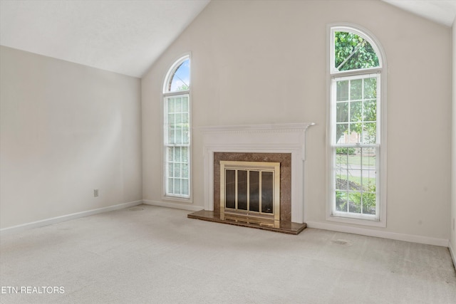 3804 Whitworth Dr, Knoxville, TN 37938 - unfurnished living room featuring a high end fireplace, lofted ceiling, carpet floors, and baseboards