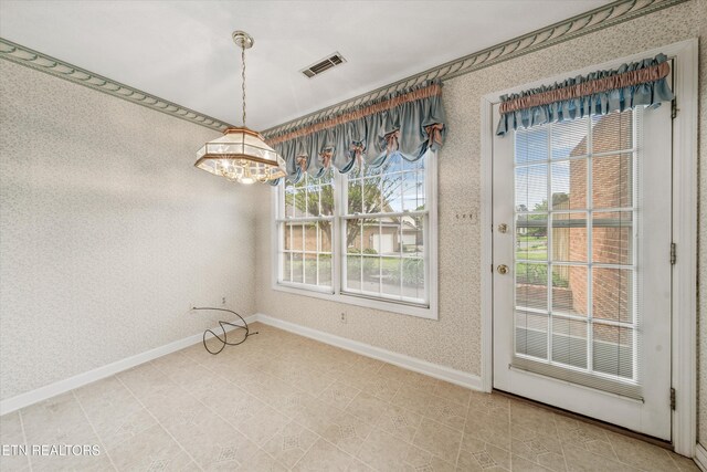 3804 Whitworth Dr, Knoxville, TN 37938 - unfurnished dining area with wallpapered walls, visible vents, baseboards, and a notable chandelier