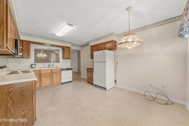 3804 Whitworth Dr, Knoxville, TN 37938 - kitchen featuring baseboards, a notable chandelier, white appliances, and light countertops