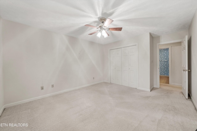 3804 Whitworth Dr, Knoxville, TN 37938 - unfurnished bedroom with light carpet, baseboards, a closet, and ceiling fan