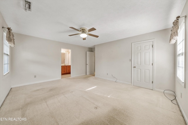3804 Whitworth Dr, Knoxville, TN 37938 - unfurnished bedroom featuring visible vents, baseboards, connected bathroom, and light colored carpet