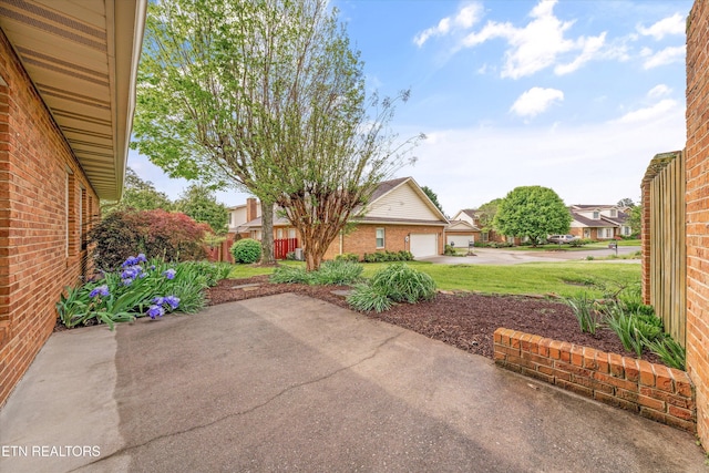 3804 Whitworth Dr, Knoxville, TN 37938 - view of patio with driveway, fence, and a garage