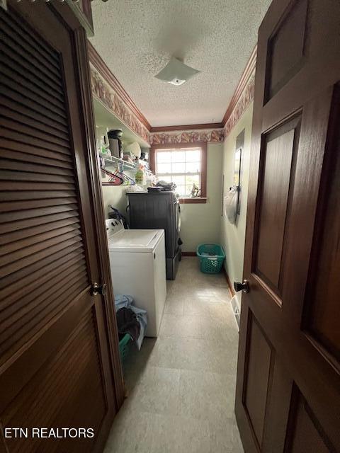 205 Hickory Ln, Jacksboro, TN 37757 - clothes washing area with laundry area, independent washer and dryer, crown molding, and a textured ceiling