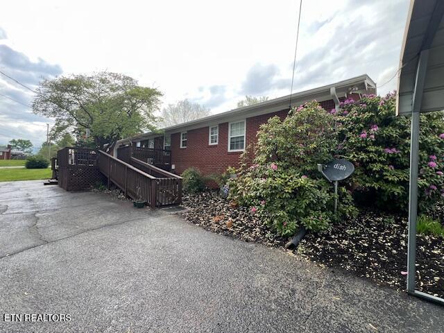 205 Hickory Ln, Jacksboro, TN 37757 - view of side of property featuring brick siding