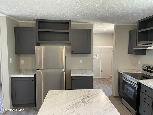 kitchen with appliances with stainless steel finishes, open shelves, gray cabinetry, and a textured ceiling