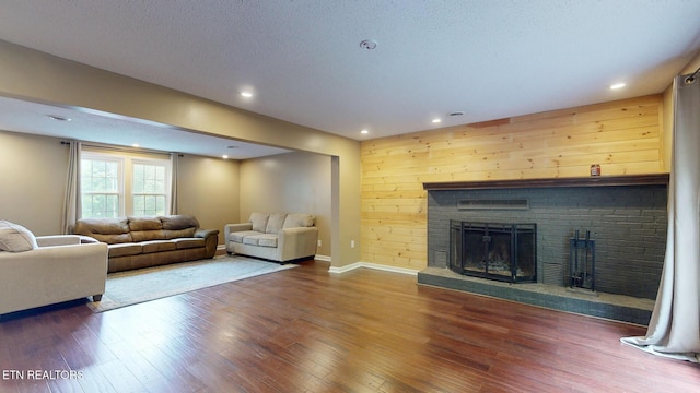 1624 Capitol Blvd, Knoxville, TN 37931 - living area featuring wood finished floors, a fireplace, baseboards, recessed lighting, and a textured ceiling