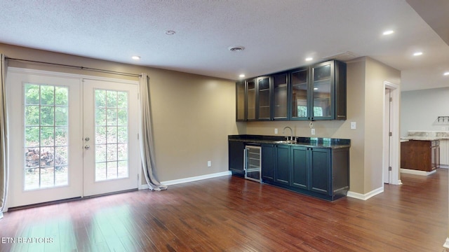 1624 Capitol Blvd, Knoxville, TN 37931 - indoor wet bar featuring beverage cooler, french doors, dark wood-type flooring, baseboards, and recessed lighting