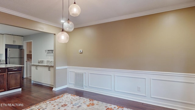 1624 Capitol Blvd, Knoxville, TN 37931 - unfurnished dining area featuring dark wood-style floors, crown molding, and a wainscoted wall
