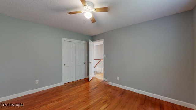 1624 Capitol Blvd, Knoxville, TN 37931 - unfurnished bedroom featuring baseboards, wood finished floors, a closet, and a ceiling fan
