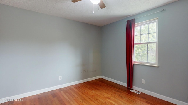 1624 Capitol Blvd, Knoxville, TN 37931 - empty room featuring a ceiling fan, wood finished floors, baseboards, and a textured ceiling