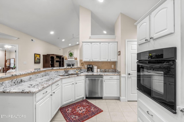 kitchen with stainless steel dishwasher, black oven, a peninsula, a sink, and vaulted ceiling