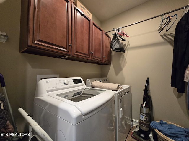 184 Danielle Ct, Harrogate, TN 37752 - clothes washing area featuring baseboards, cabinet space, and washing machine and clothes dryer
