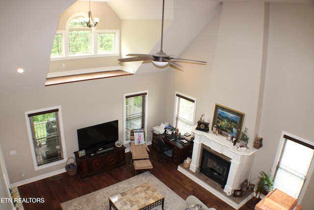 184 Danielle Ct, Harrogate, TN 37752 - living room with high vaulted ceiling, a glass covered fireplace, baseboards, wood finished floors, and ceiling fan with notable chandelier