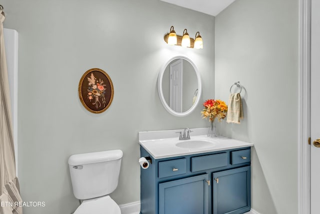 bathroom with vanity and toilet