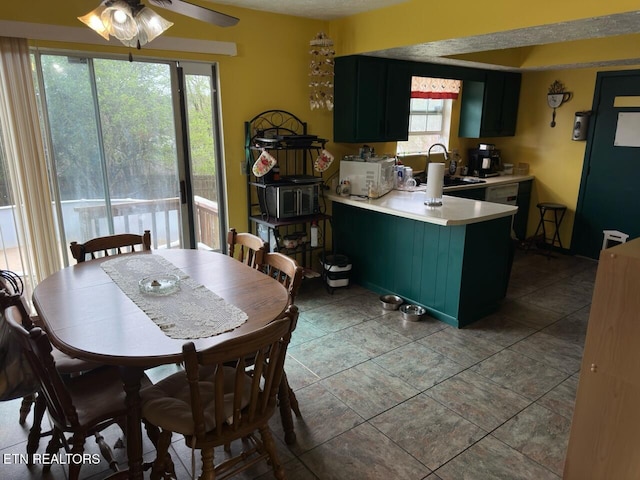 dining room with a ceiling fan