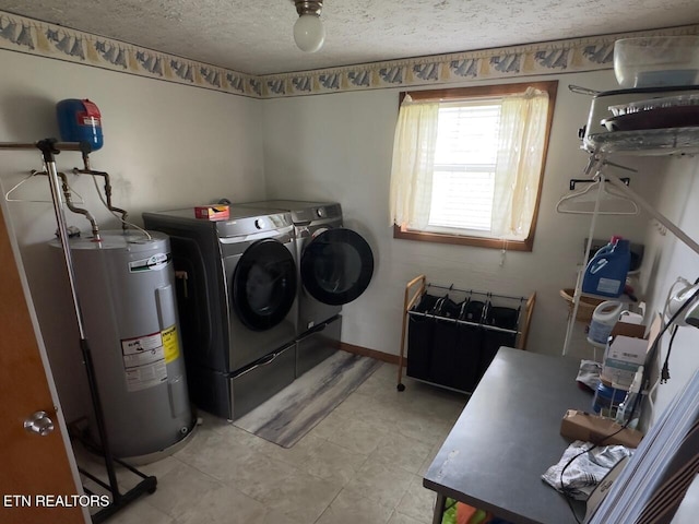 washroom with washer and dryer, electric water heater, laundry area, and a textured ceiling