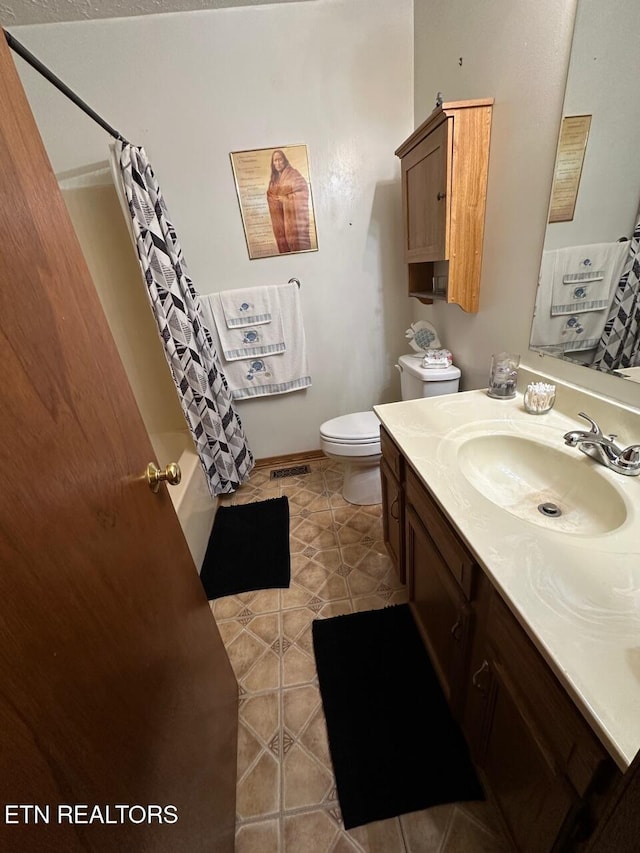 full bath with toilet, visible vents, shower / tub combo, tile patterned flooring, and vanity