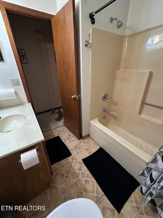 full bath with vanity, tile patterned floors, and shower / tub combination