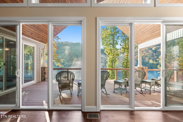 entryway featuring wood finished floors and visible vents