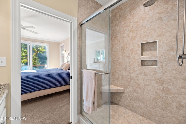 full bathroom featuring ensuite bath, a shower stall, ceiling fan, and crown molding